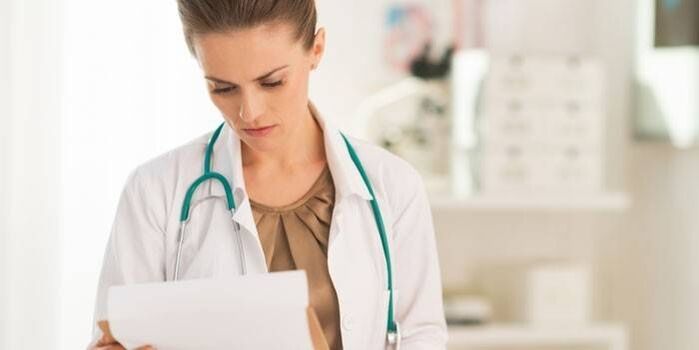 the doctor checks tests for the diagnosis of papillomavirus